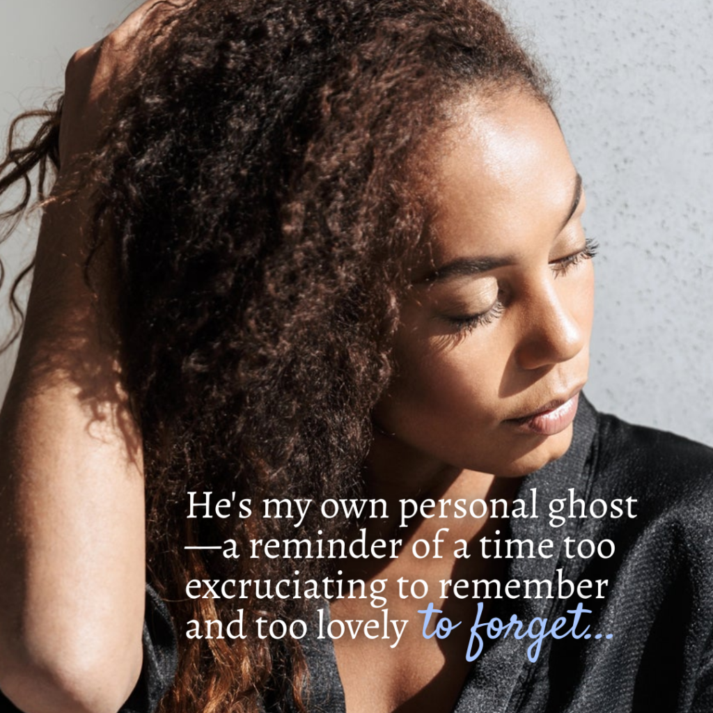 A woman with curly hair is looking down.