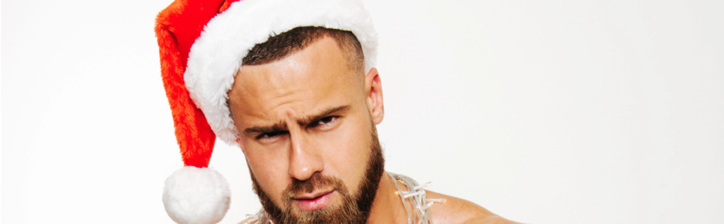 A man with a beard and a white hat.