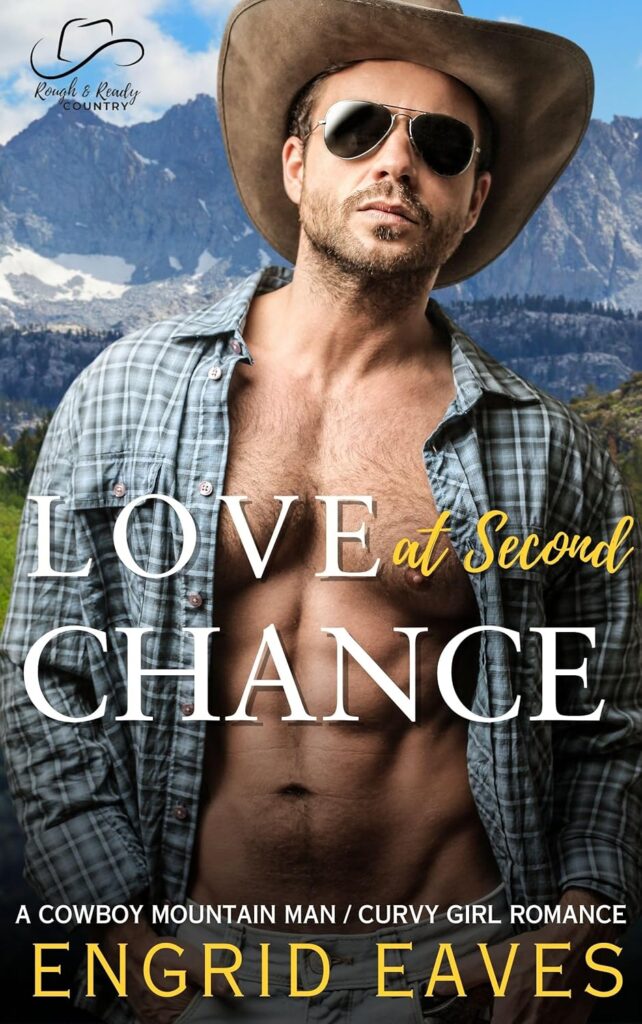 A man in a cowboy hat and shirt with mountains behind him.